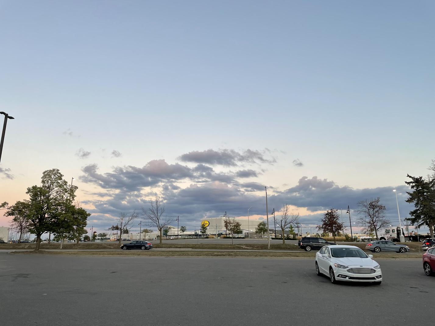 Strip-mall parking lot at dusk, Ontario